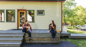 Father and daughter drinking coffee on their backyard