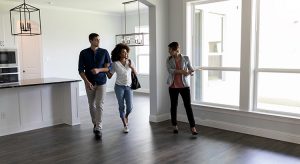 Couple meets with realtor showing property