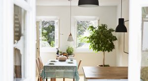 Bright modern kitchen and dining room in an old country house
