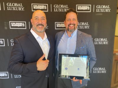 Erol Bayraktar and Richard Wamsat holding a certificate