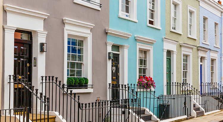 Street in residential district with row houses in London, UK