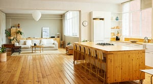 Chairs arranged at kitchen island in apartment