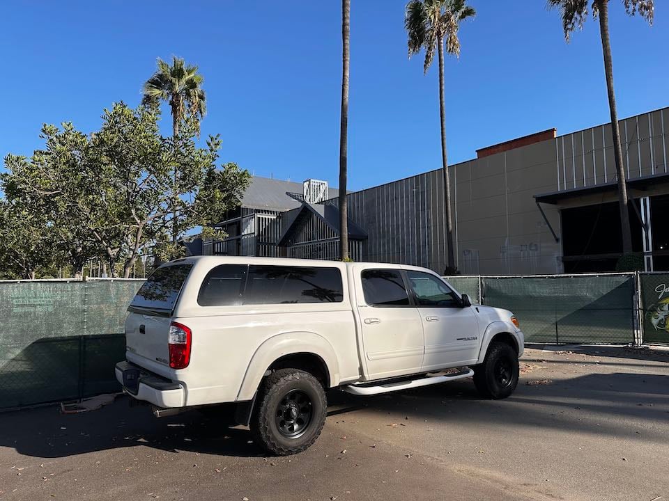 White truck in front of a construction site for Bass Pro in Irvine