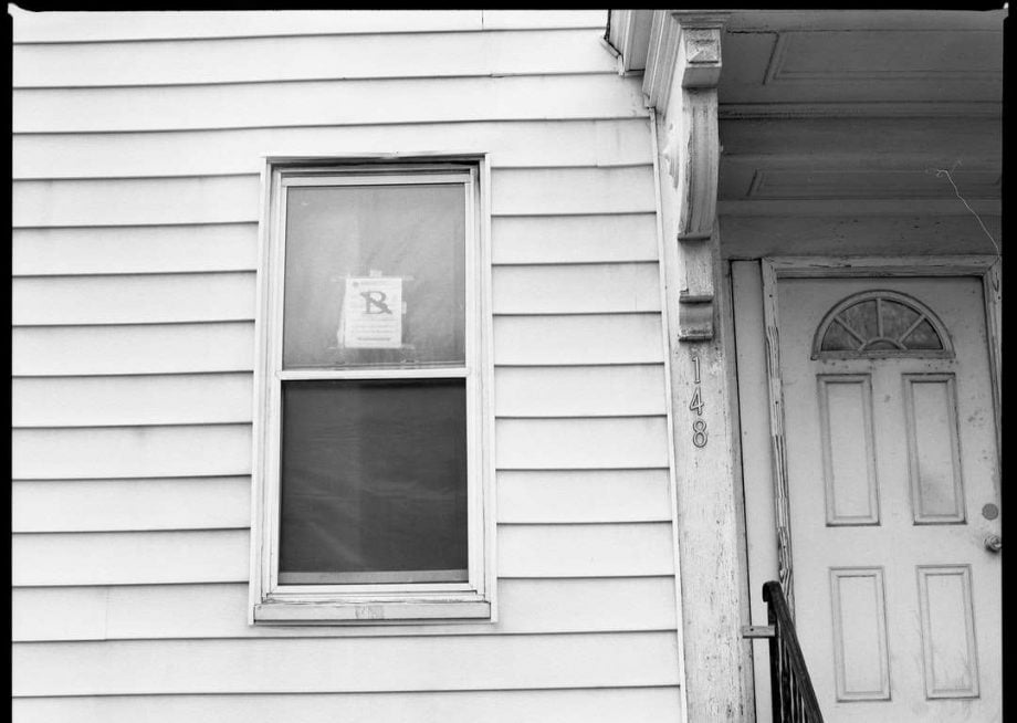 house with an eviction notice in window