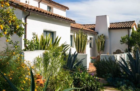 Spanish Homes with lush desert landscape.