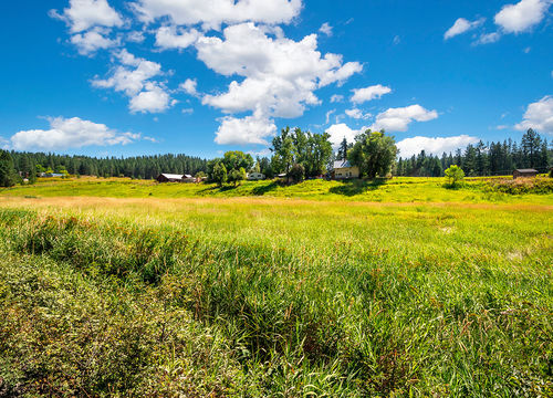 Homes along the top of a small ledge in the rural area near Colb