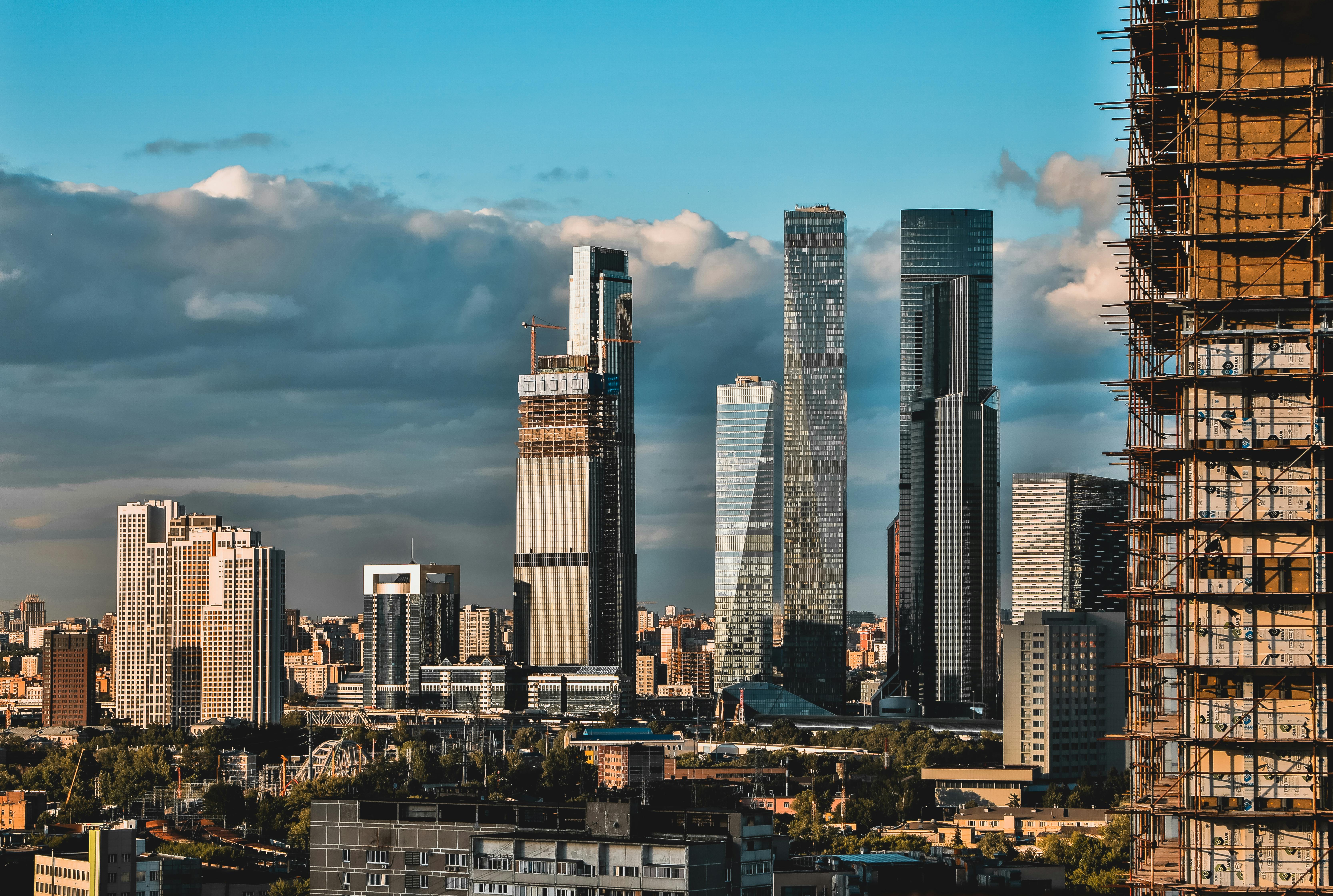 High-Rise Buildings Near White Clouds