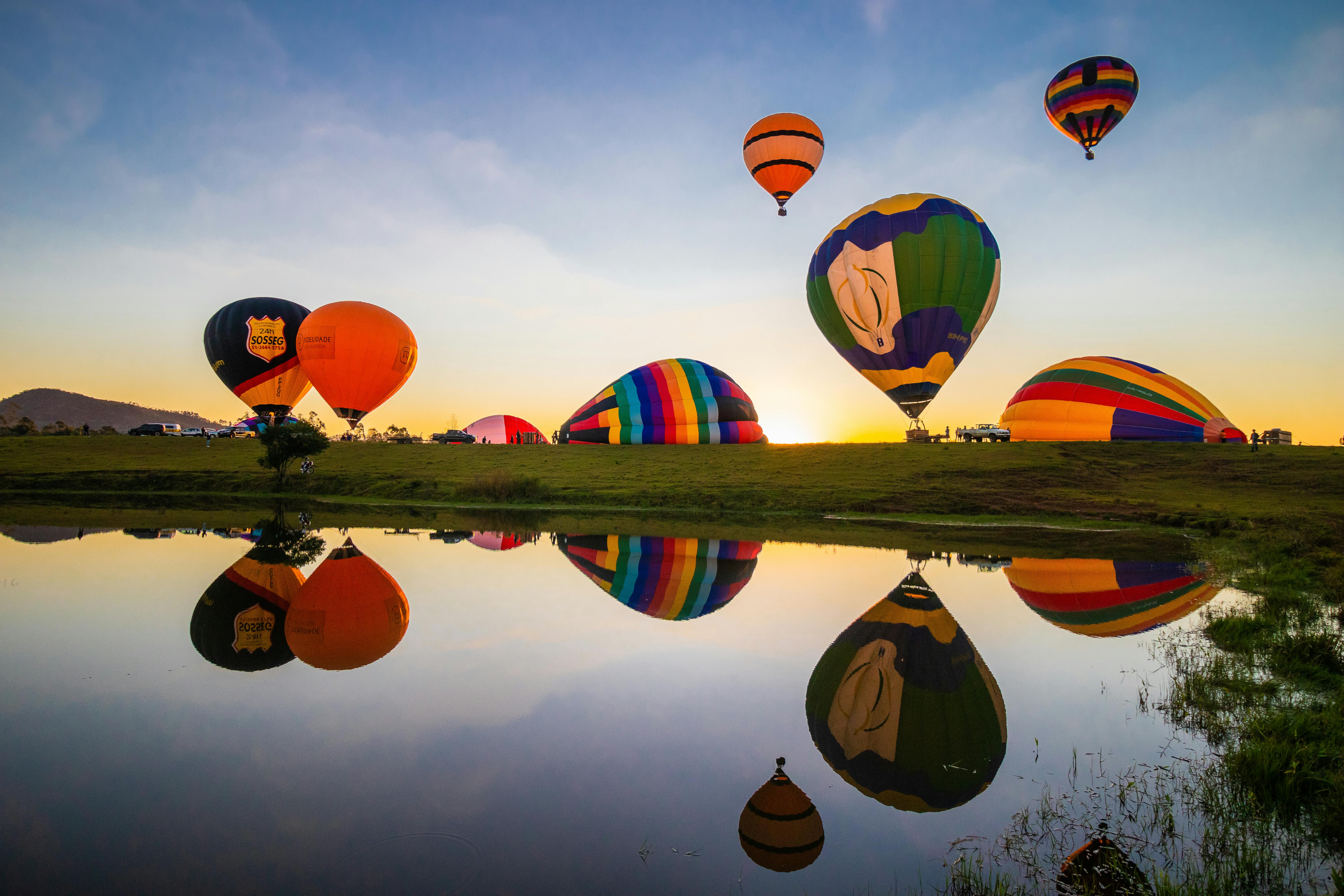 Balloons Reflection in Water at Sunset