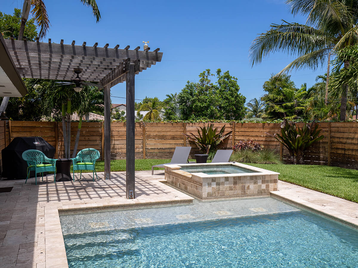 Backyard-of-a-modern-house-with-swimming-pool-and-artificial-grass