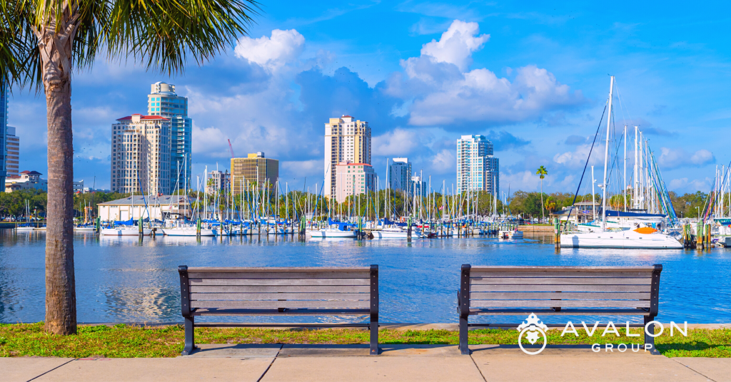 St Petersburg Top Florida City For Work-Life picture shows two park benches overlooking the St. Petersburg FL Marina with deep blue water.
