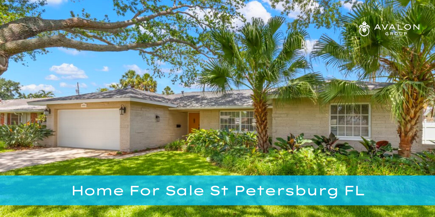 Home For Sale St Petersburg FL Cover Picture shows warm white home with an orange door.