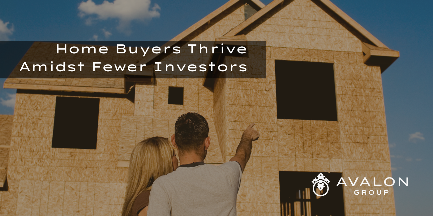 Home Buyers Thrive Amidst Fewer Investors Cover picture shows a husband and wife pointing to the window of a home under construction.
