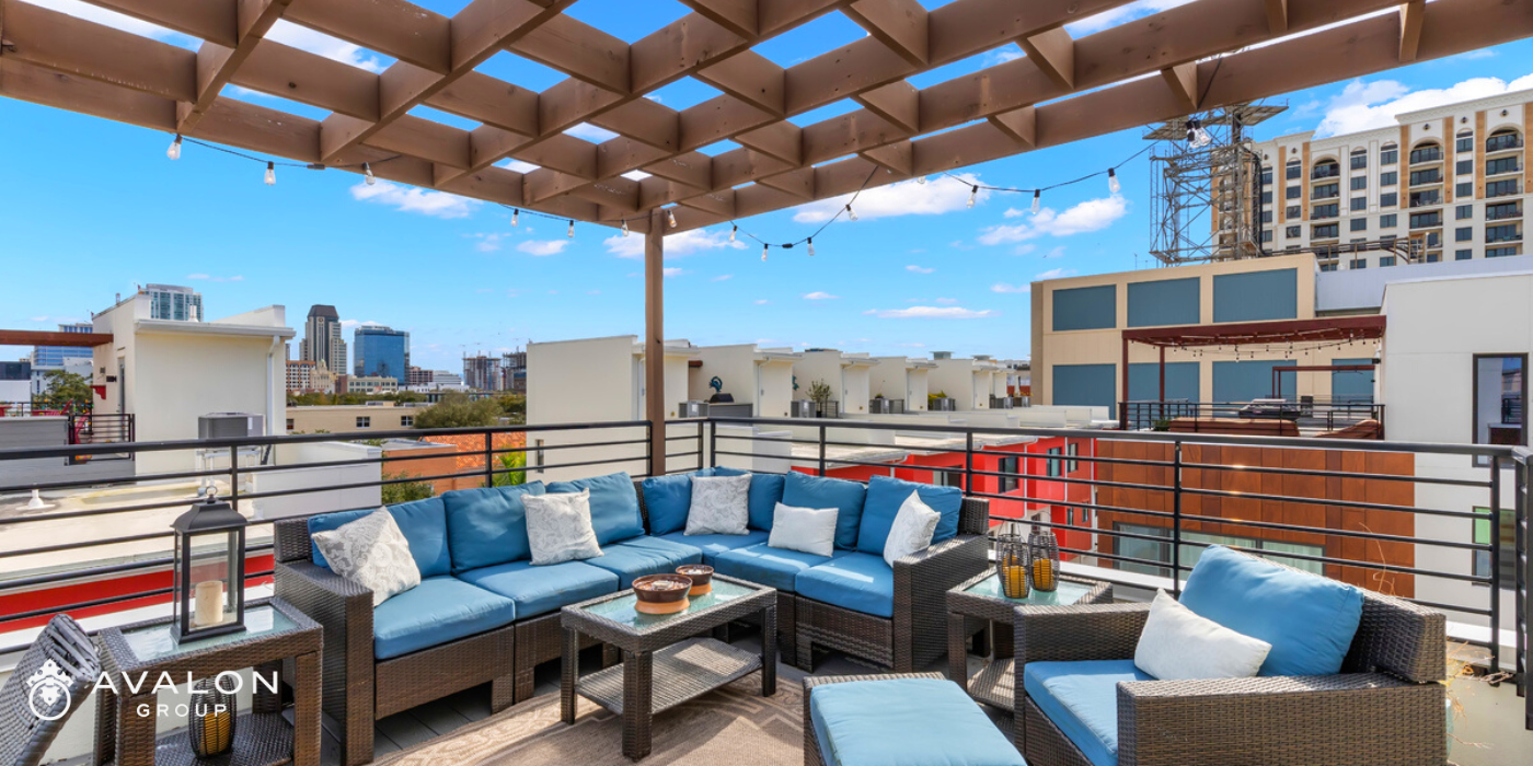 A recent townhome we sold with a rooftop deck that overlooks downtown St Petersburg FL.  The outdoor sofa has blue cushions that emphasize the blue skies.