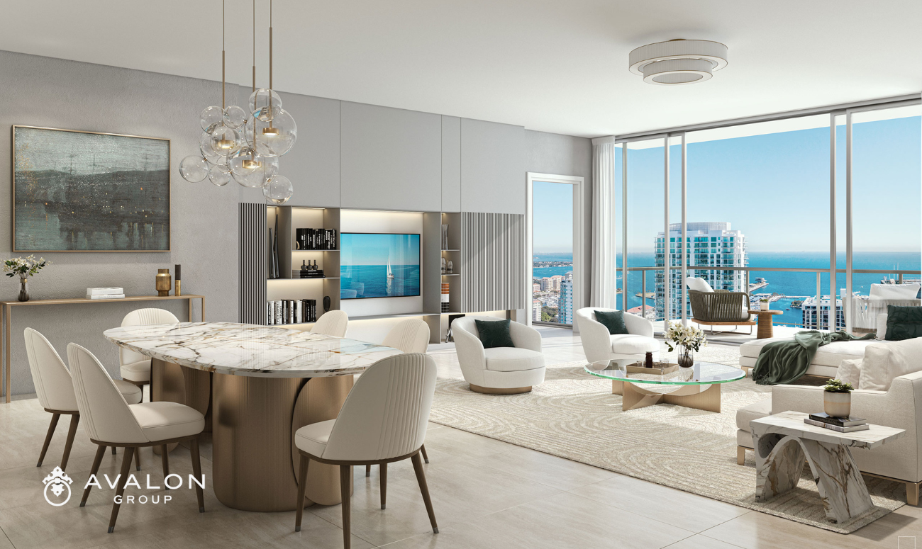 Art House Luxury Condos For Sale picture shows a dining room and living room with a balcony with views of Tampa Bay.