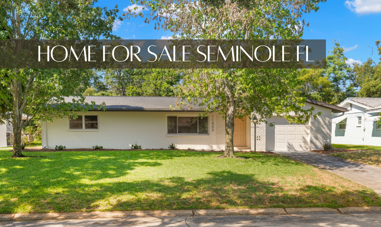 Home For Sale Seminole FL cover picture shows a modern ranch home that is painted white with charcoal trim.
