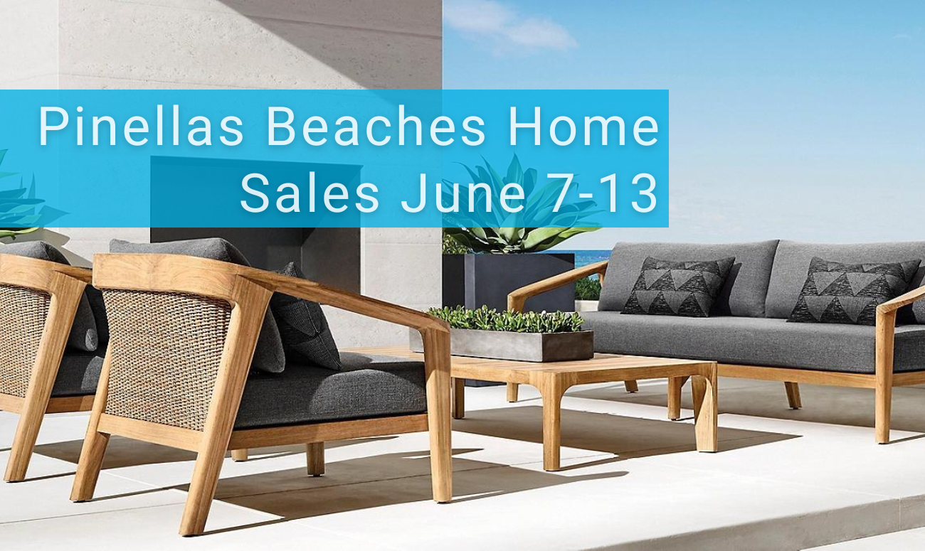Pinellas Beaches Home Sales June 7-13 picture shows an outdoor seating area with wood furniture and gray cushions. In the background is the ocean water.