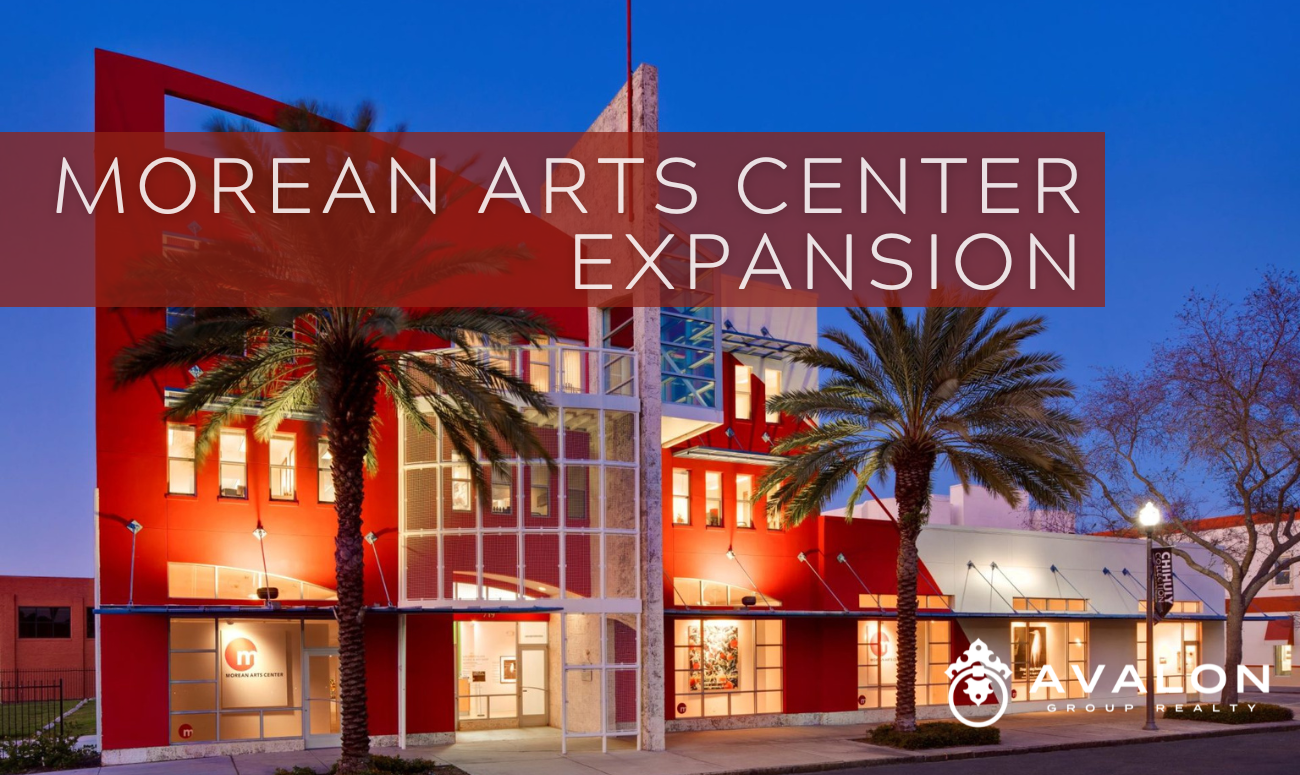 Morean Arts Center Expansion cover picture shows the existing Arts building at night time lighted up with orange walls.