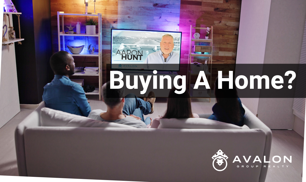 Buying a Home? cover picture shows two men and two women on a sofa watching the TV.