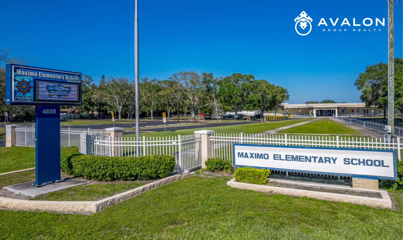 The Pink Streets of St. Petersburg Maximo Elementary School picture shows the school signs in the front green lawn.