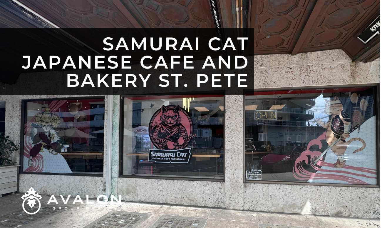 Samurai Cat Japanese Cafe and Bakery St. Pete picture shows the front facade of the cafe with window are of Samarai cats dressed in black and red.