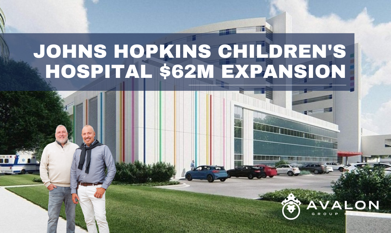 Johns Hopkins Children's Hospital $62M Expansion picture shows a rendering of the new hospital expansion that is white with rainbow color lines that are vertical.