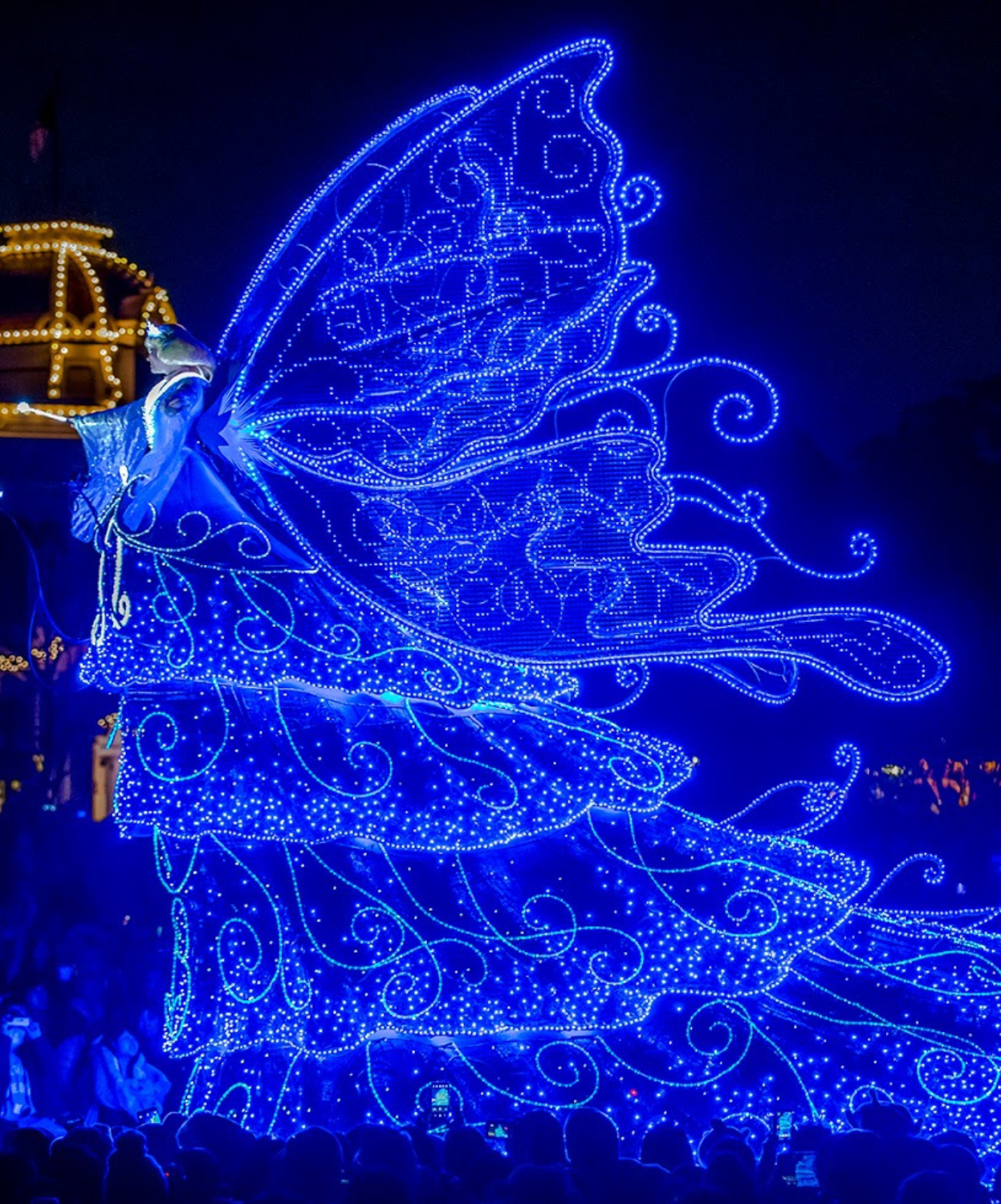 Disney Starlight Parade at Magic Kingdom-5 picture shows the blue fairy float lite up in all blue lights.
