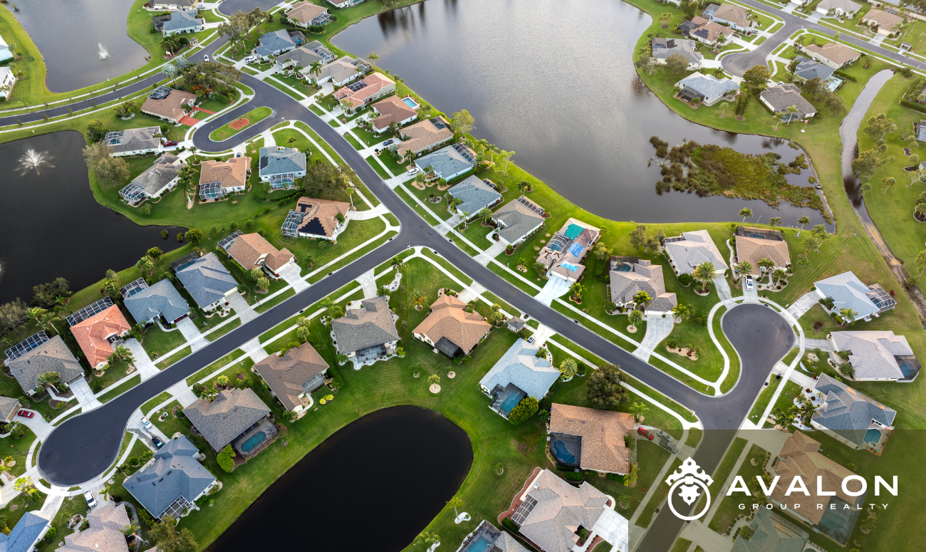 Ariel view of a Florida Neighborhood in a Flood Zone. There are small ponds that separates the streets of homes.