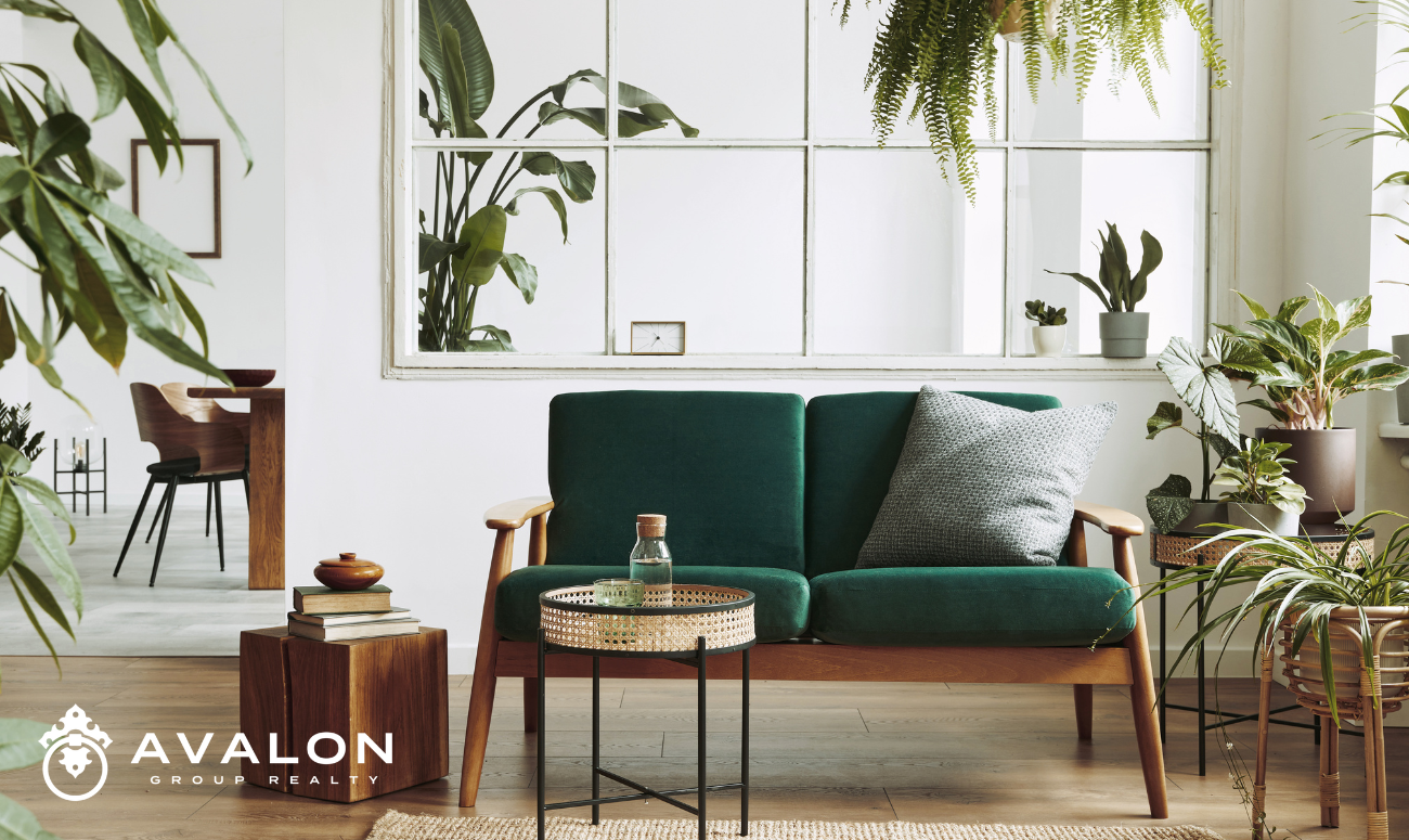 Why 2025 Is a Turning Point for Homebuyers & Sellers — And Why Choosing the Right St Petersburg Realtor Matters More Than Ever. The picture shows a home staged with Japan furniture with wood tones, green accents, warm white walls, and lots of live plants.
