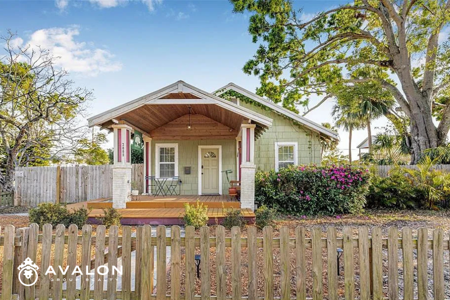Historic Kenwood St. Petersburg Craftsman-style home with front porch and mature landscaping in the 2026 real estate market.