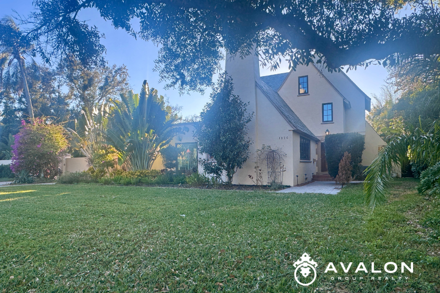 Charming single-family home in the Jungle Prada neighborhood of St. Petersburg FL, surrounded by mature trees, lush landscaping, and a quiet residential setting.