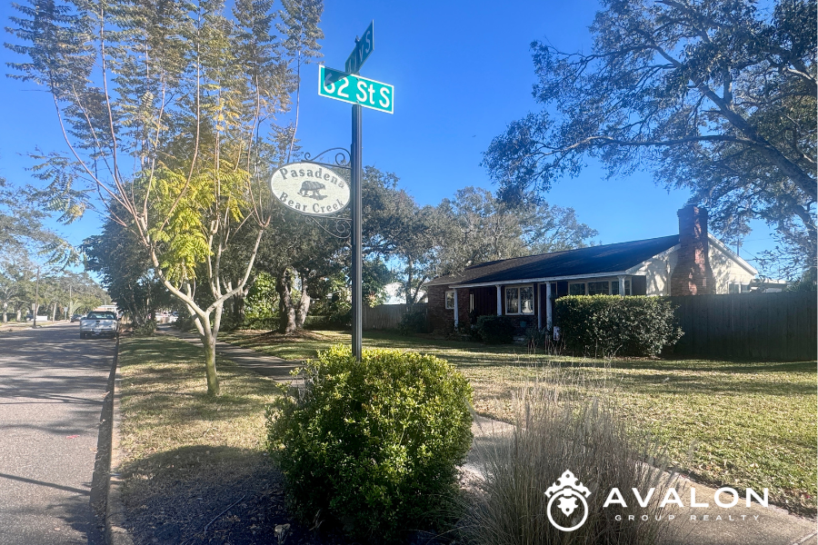 Pasadena Bear Creek Estates neighborhood sign at 62nd Street South in St. Petersburg FL, surrounded by mature trees, sidewalks, and well-maintained homes.