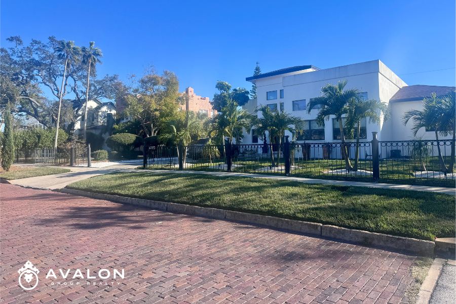 Modern and Mediterranean-style homes along a brick-lined street in Pasadena Bear Creek Estates, a quiet and safe neighborhood in St. Petersburg Florida.