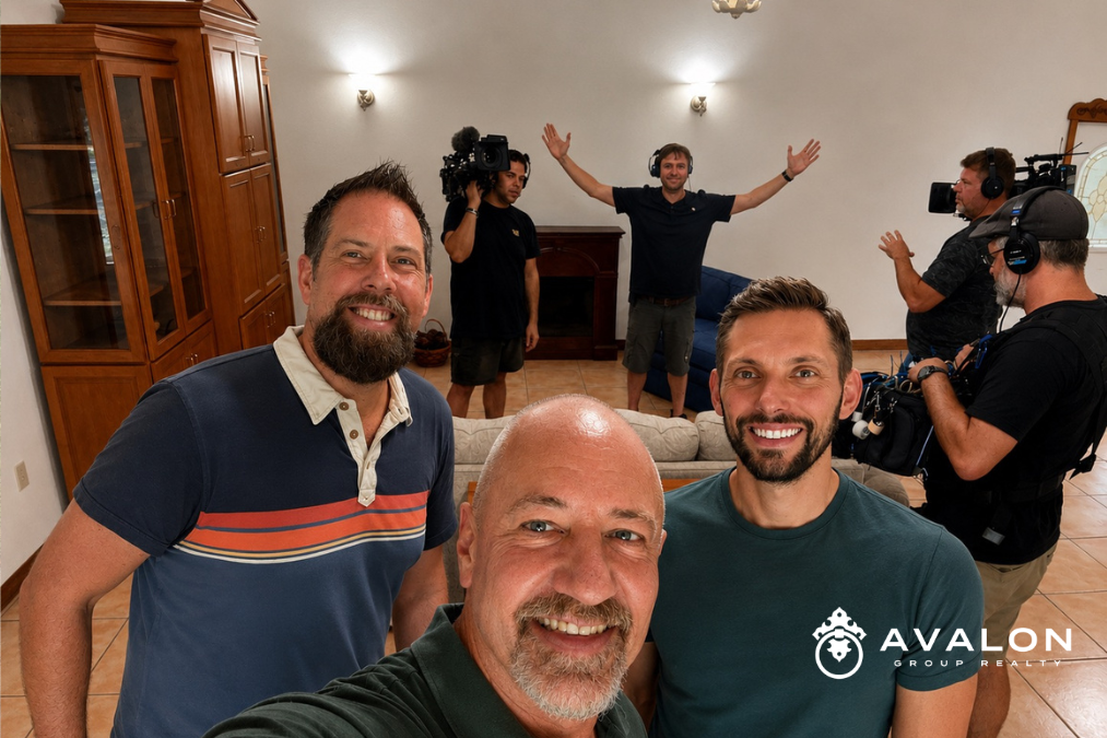 Behind-the-scenes selfie during filming of HGTV House Hunters “A Bear of a House Hunt” in Lakewood Ranch, featuring Rob Johnson, homebuyers Chris and Kyle, and the HGTV production crew inside the home where the memorable kitchen wood stain scene was filmed.