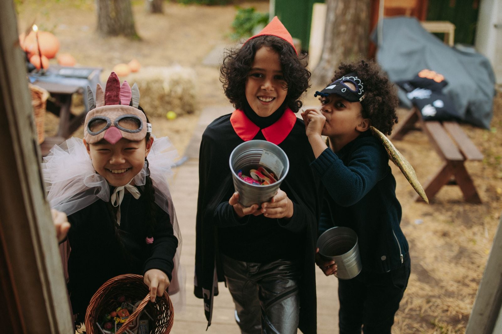 Children trick-or-treating with Halloween candy