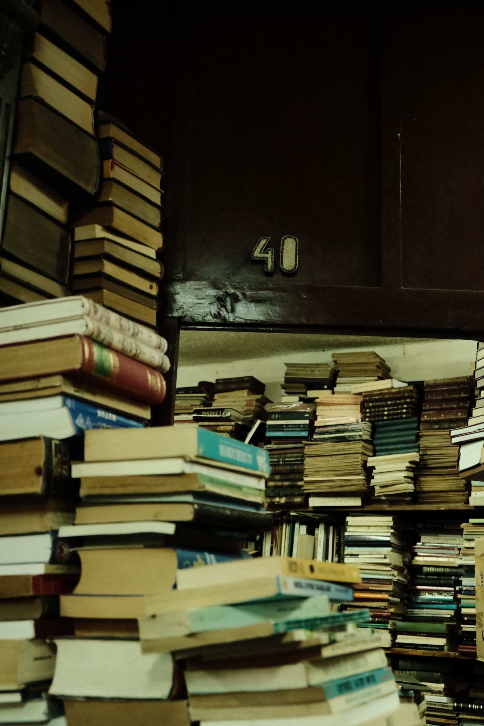 Stacks of old books in a library