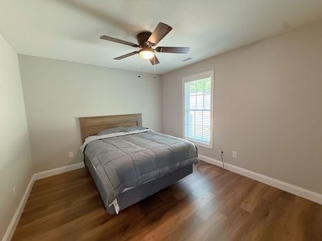 Primary bedroom with ensuite bathroom entrance in nearly new Chester SC home.