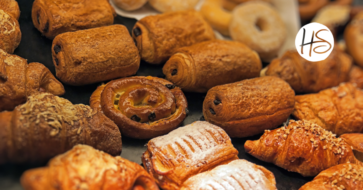 Rows of varying pastries with the HomeSource Realty logo in the upper right hand corner.