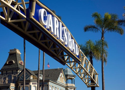 The sign for Carlsbad, California over the main intersection in town.