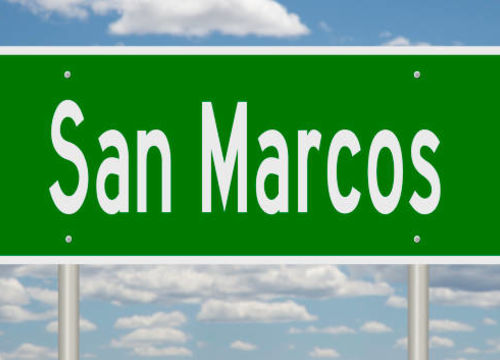 Rendering of a green road sign for San Marcos