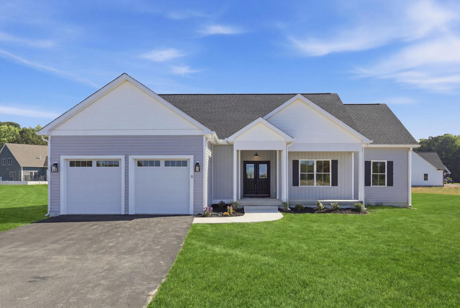Single-story new construction home with a two-car garage in Ocean Pines, MD