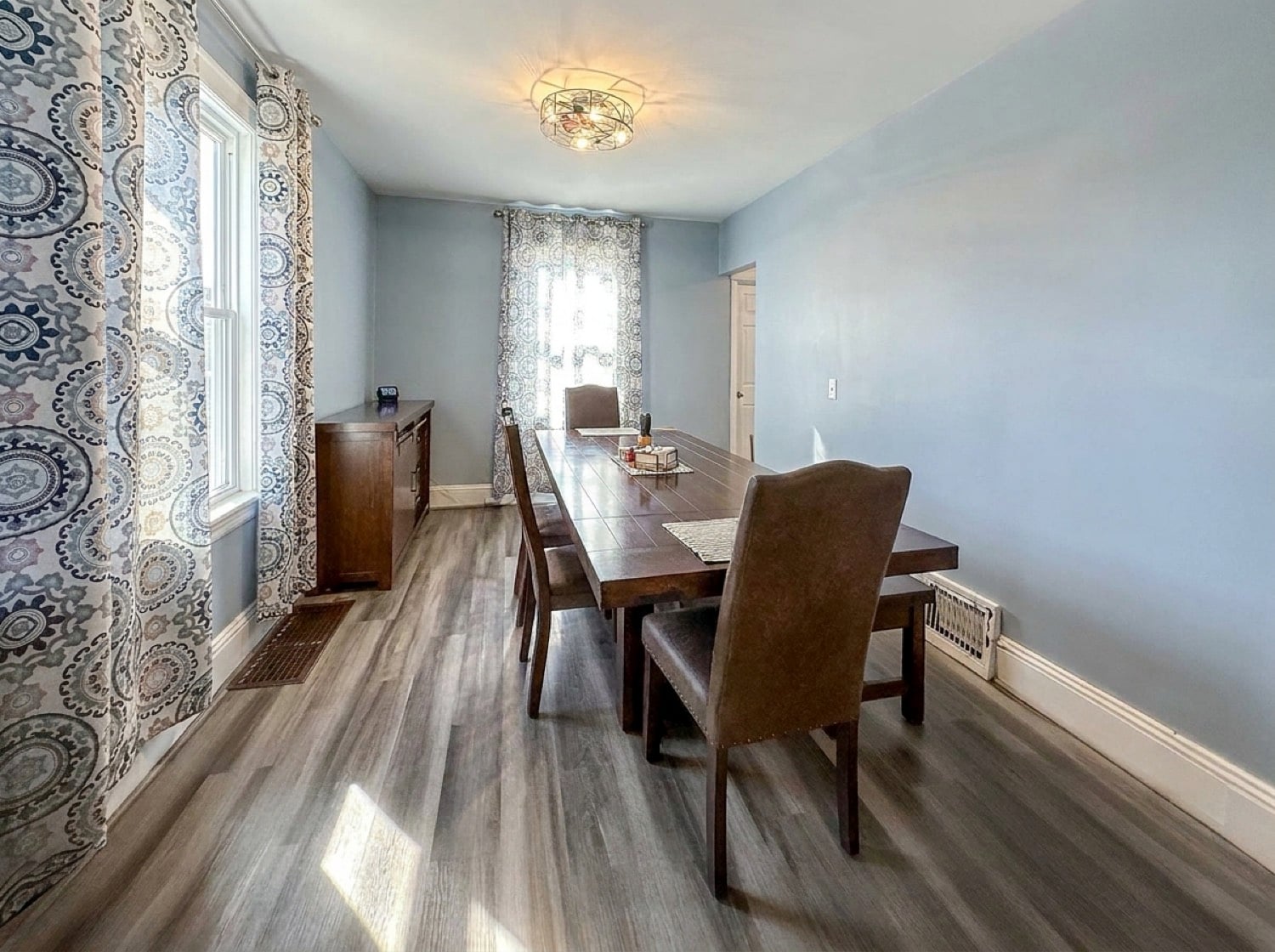 Dining room with classic moldings and hardwood floors in Port Richmond Staten Island home