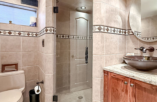 Bathroom with shower and vanity