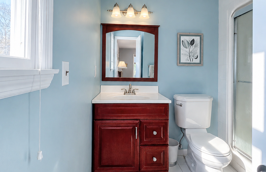 Bright 3:4 bathroom in Primary bedroom featuring a modern vanity, walk-in shower, and natural light in this well-maintained Tottenville Staten Island home.