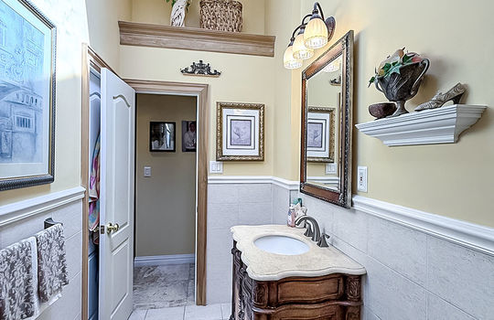 Contemporary bathroom with shared access to primary bedroom