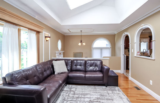 Custom living room with decorative woodwork and skylight in Prince's Bay Staten Island ranch