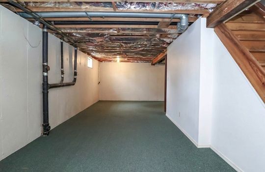 Full basement offering valuable storage space, utility access, and future possibilities.