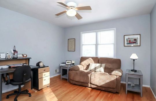 Large bedoom 3 with hardwood floors and ceiling fan