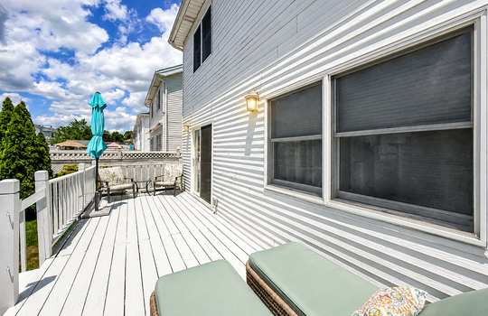 Spacious deck with outdoor lounge seating and entertaining space in a South Shore home.