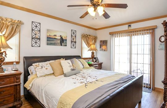 Spacious primary bedroom with custom finishes in Prince's Bay Staten Island home