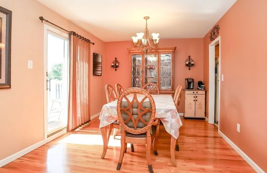 Dining Room with hardwood floors and access to balcony